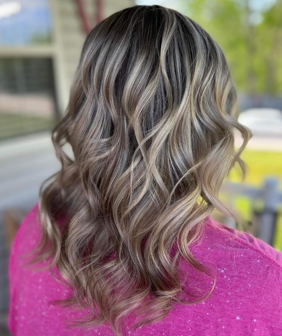 Blonde curls over a darker base, heavily contrasted.